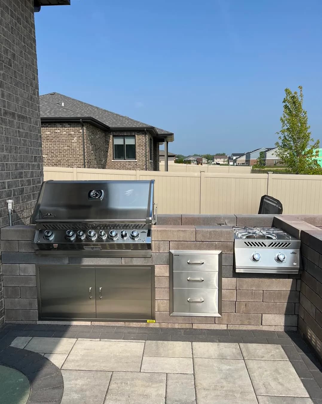 Outdoor kitchen island with entertaining space in Plainfield, IL