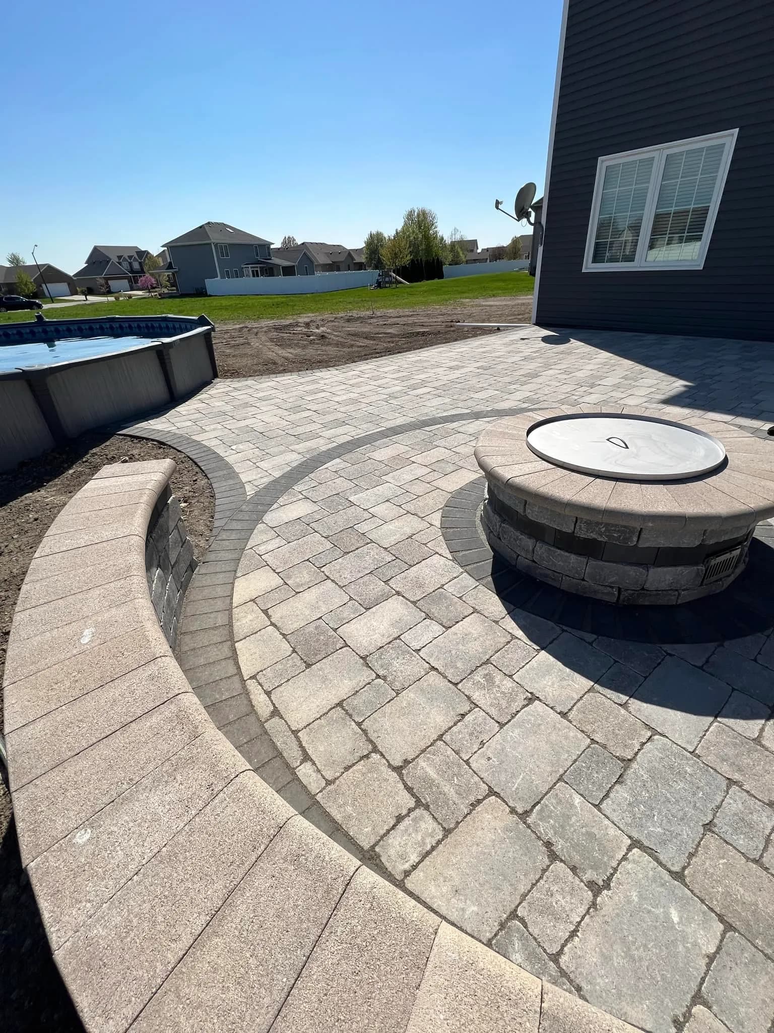 Circular paver patio with fire pit in Plainfield, Illinois