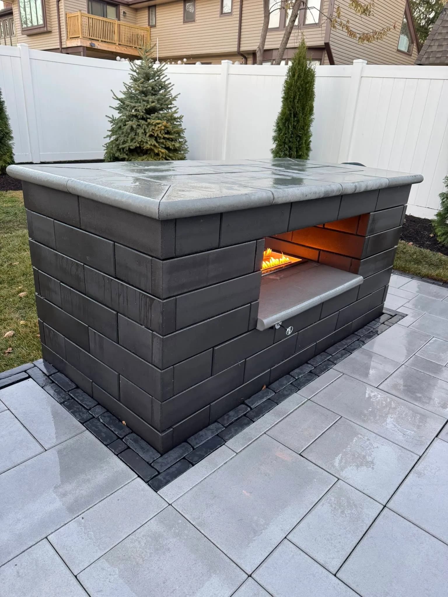 Outdoor fire feature with paver surround in Joliet, Illinois