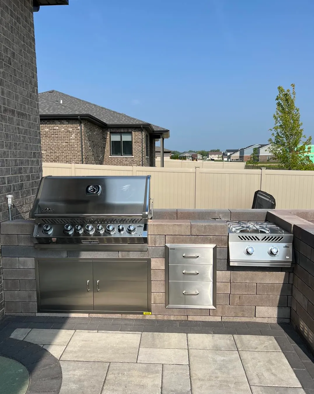 Outdoor kitchen island with entertaining space in Plainfield, IL