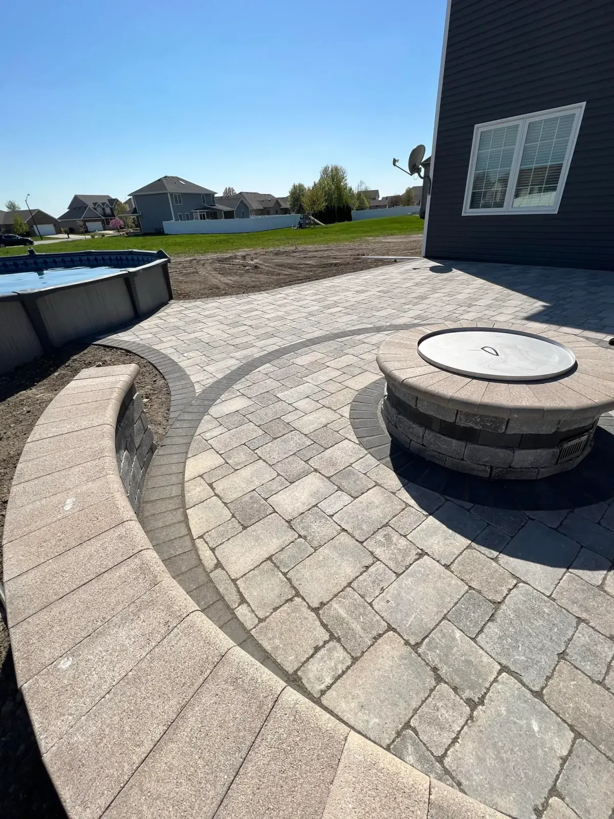 Circular paver patio with fire pit in Plainfield, Illinois