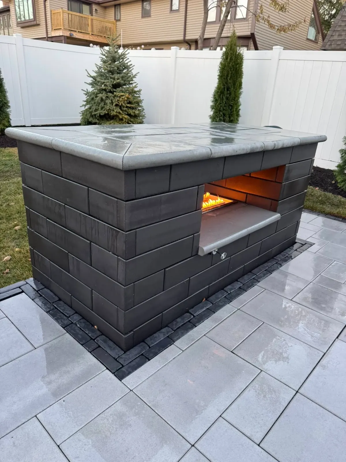 Outdoor fire feature with paver surround in Joliet, Illinois